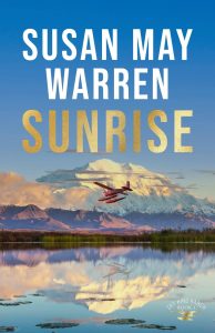 Sunrise book cover plane flies above snowcovered mountain